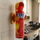 Fire Stop spray mounted in its bracket on a garage wall